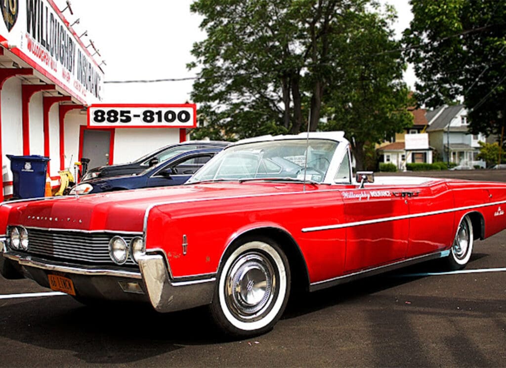 Auto Insurance - Beautiful View of a Older Red Car Parked in a Parking Lot